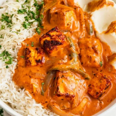 Delicious cottage cheese tikka curry served in a bowl with aromatic spices.