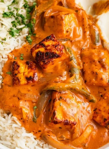 Delicious cottage cheese tikka curry served in a bowl with aromatic spices.
