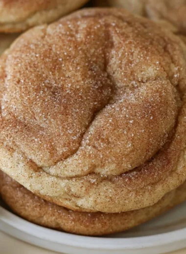 Batch of freshly baked maple snickerdoodles on a cooling rack