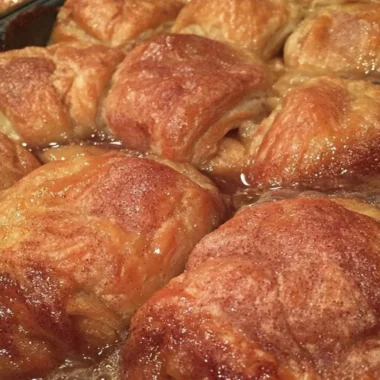 Delicious homemade country apple dumplings served with cinnamon sauce