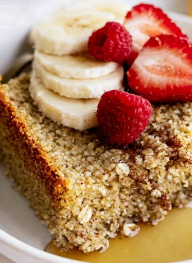Delicious baked oatmeal served in a warm bowl with fruits and nuts