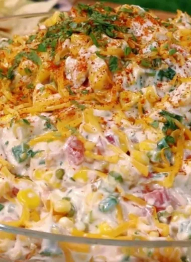 Cozy cold street corn dip served in a bowl with fresh toppings