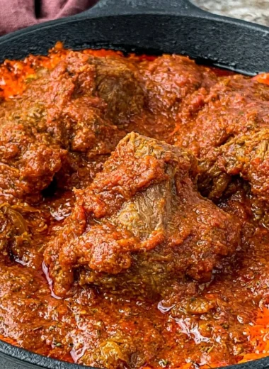 Delicious Nigerian beef stew served in a bowl, showcasing rich flavors and ingredients.