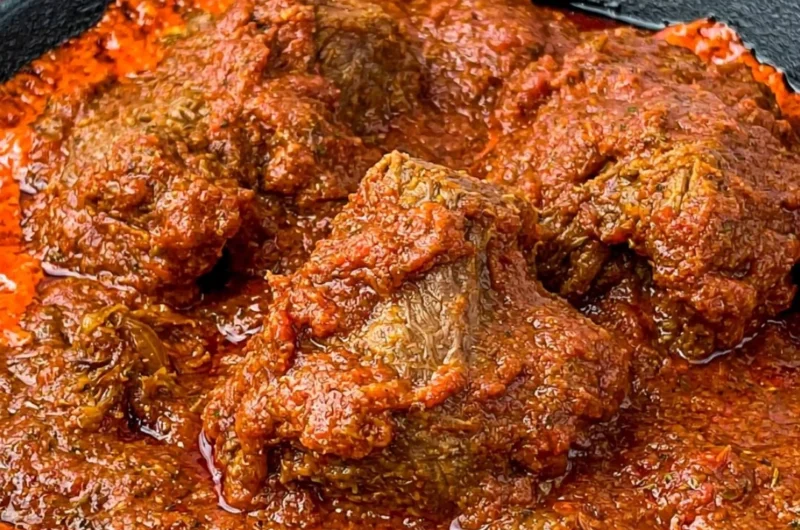 Delicious Nigerian beef stew served in a bowl, showcasing rich flavors and ingredients.