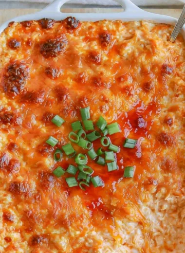 Cozy cottage cheese buffalo chicken dip in a bowl with chips on the side