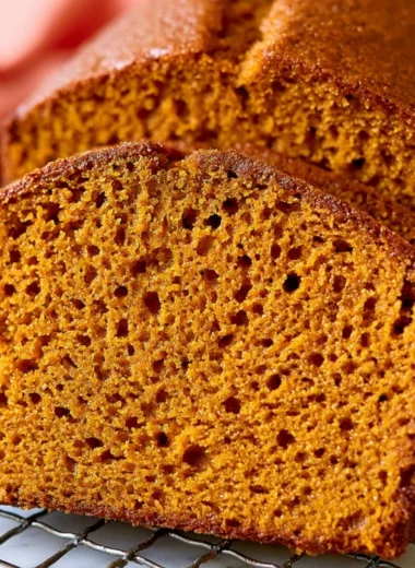 Healthy pumpkin bread loaf cooling on a wire rack