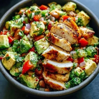 Creamy avocado chicken salad served in a bowl with fresh ingredients