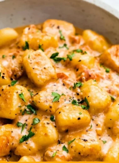 Garlic Butter Gnocchi served with fresh herbs and parmesan cheese