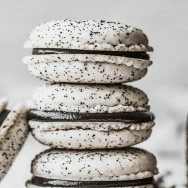 Delicious Oreo Macarons displayed on a decorative plate.
