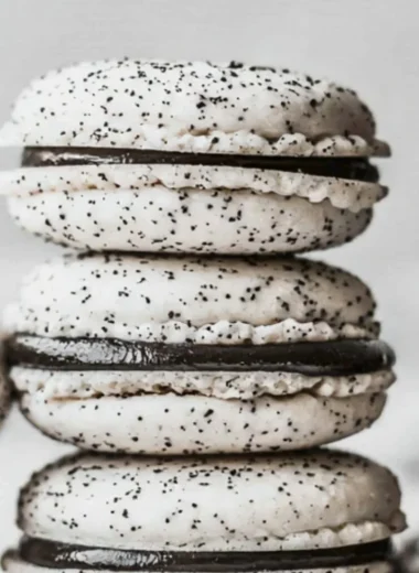 Delicious Oreo Macarons displayed on a decorative plate.
