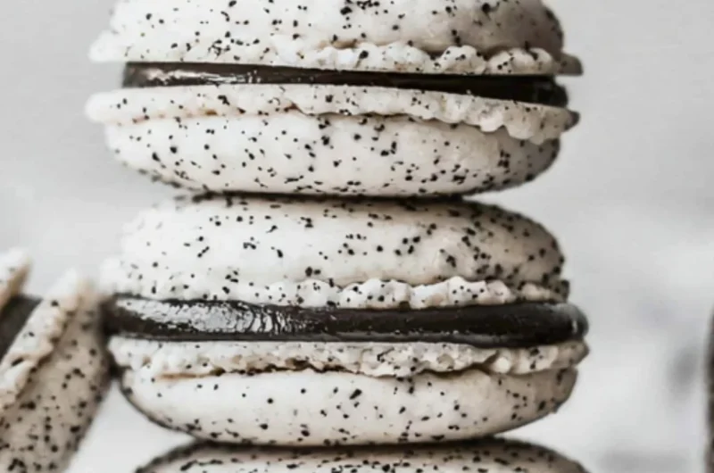 Delicious Oreo Macarons displayed on a decorative plate.
