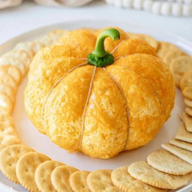 Pumpkin shaped cheese ball decorated for fall gatherings