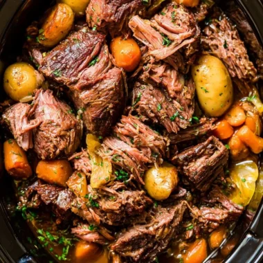 Tender and flavorful Crock Pot Chuck Roast served with vegetables