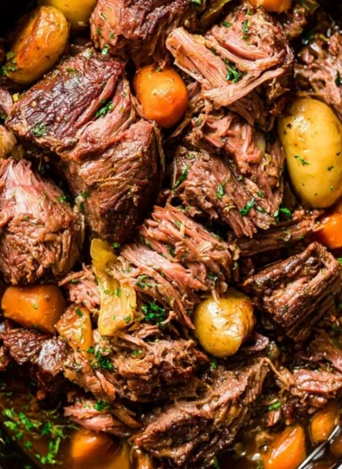 Tender and flavorful Crock Pot Chuck Roast served with vegetables