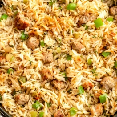 Cozy Cajun Dirty Rice with Sausage served in a bowl, showcasing rich flavors and spices.