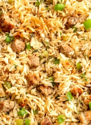 Cozy Cajun Dirty Rice with Sausage served in a bowl, showcasing rich flavors and spices.