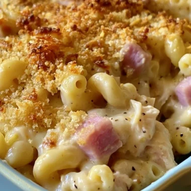 Delicious Chicken Cordon Bleu Casserole topped with crispy cheese and herbs