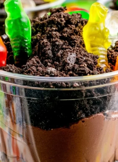 Delicious cozy dirt cups dessert with chocolate and gummy worms