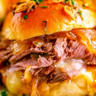 Delicious French Dip Sliders served with au jus for dipping