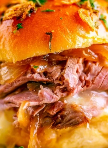 Delicious French Dip Sliders served with au jus for dipping