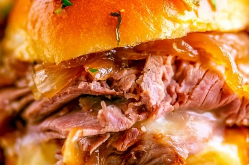 Delicious French Dip Sliders served with au jus for dipping