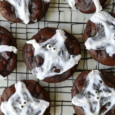 Halloween Double Chocolate Spider Web Cookies with spooky decorations