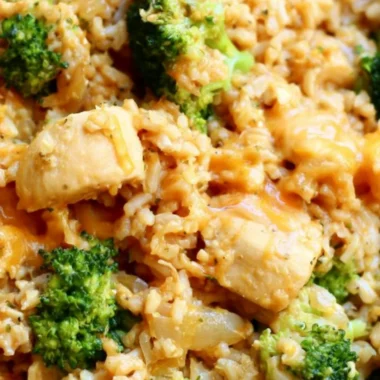 One-Pot Chicken and Rice meal prepared in a skillet with vegetables.