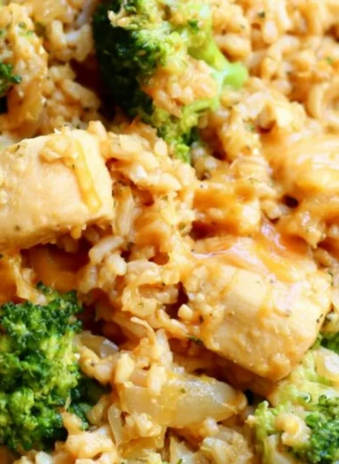 One-Pot Chicken and Rice meal prepared in a skillet with vegetables.