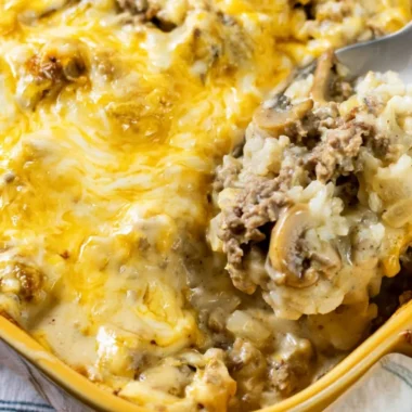 Delicious cheesy ground beef and rice casserole dish served on a table