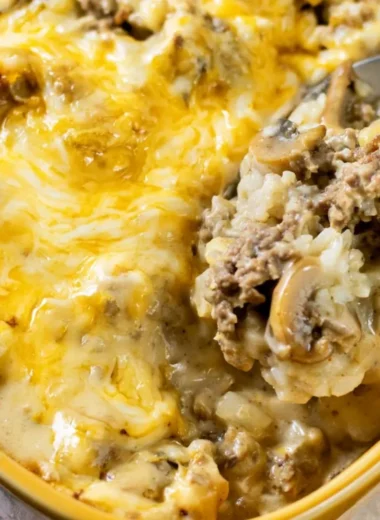 Delicious cheesy ground beef and rice casserole dish served on a table