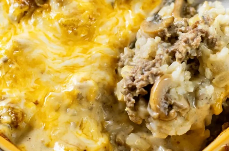Delicious cheesy ground beef and rice casserole dish served on a table