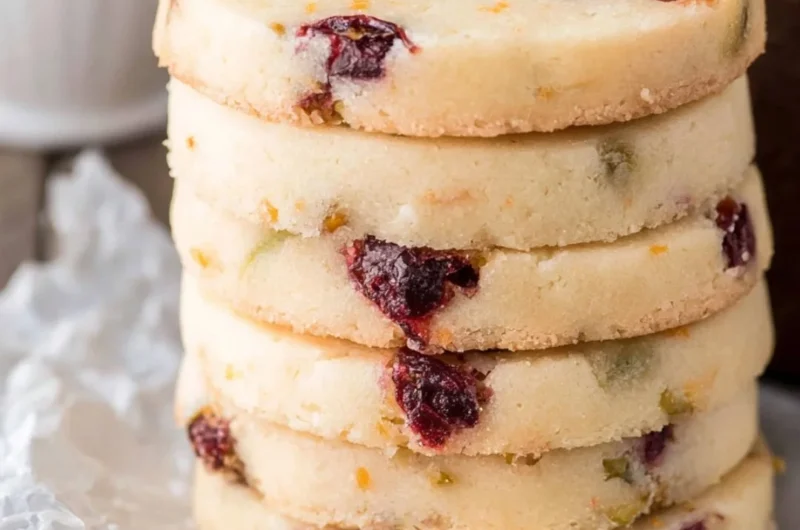 Cranberry Pistachio Shortbread cookies arranged on a festive plate