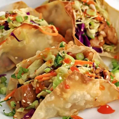 Crispy chicken wonton tacos served with fresh toppings and dipping sauce