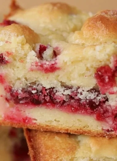 Delicious Cranberry Christmas Cake with festive decorations on a holiday table