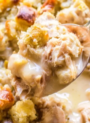 Delicious leftover turkey casserole served in a dish with vegetables and cheese.