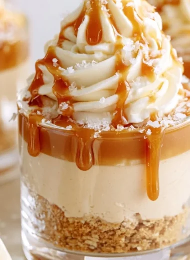 No-Bake Salted Caramel Cheesecake Cups served in elegant dessert cups