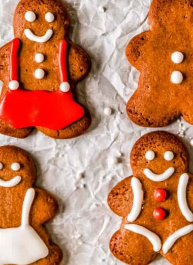 Soft and chewy gingerbread man cookies on a baking tray