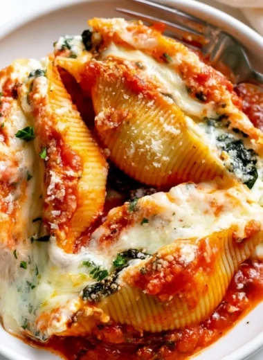 Delicious stuffed shells filled with ricotta cheese and marinara sauce