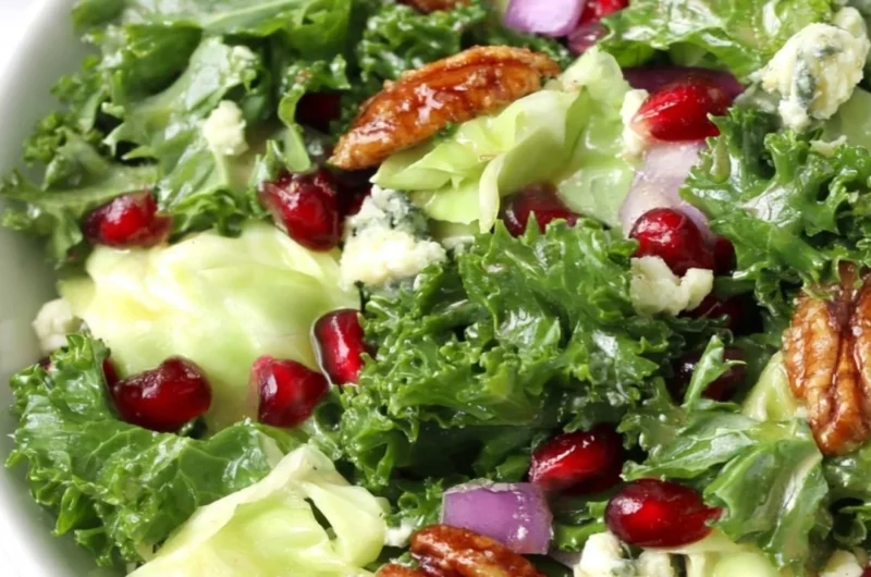 Winter Chopped Salad with Pomegranate and Blue Cheese served on a festive table
